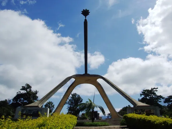 The Arusha Declaration Monument in the centre of Arusha, with a torch on top of four curved legs.