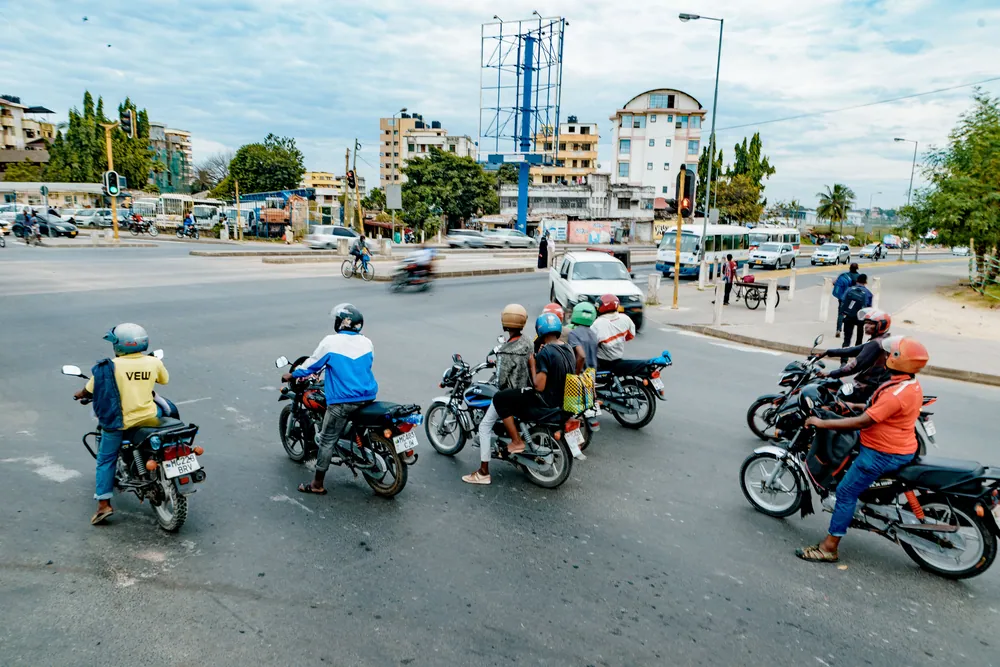 Motorcycle taxi riders waiting at a junction in Dar es Salaam