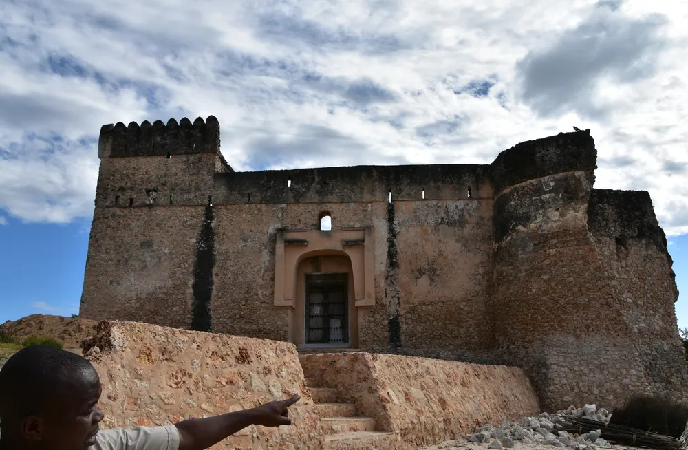 The coral-stone walls and round corner tower of Gereza fort on Kilwa Kisiwani
