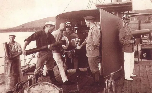German sailors and officers beside a heavy gun on the deck of the Graf von Götzen at Kigoma