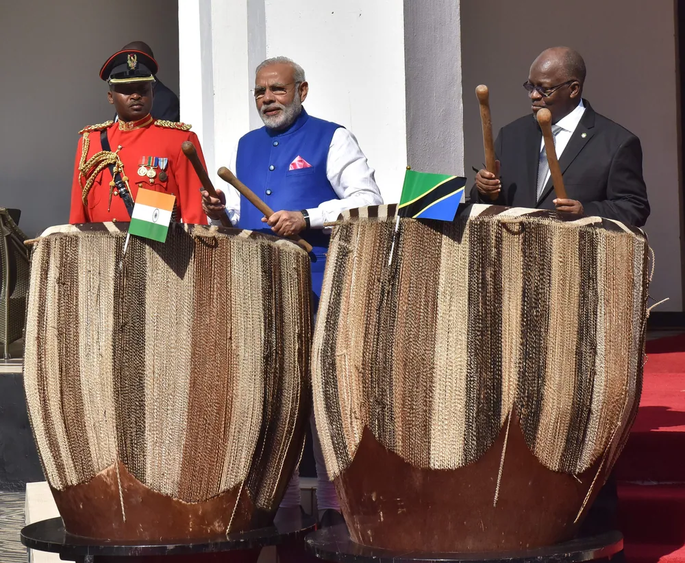 John Magufuli and Narendra Modi playing large ceremonial drums