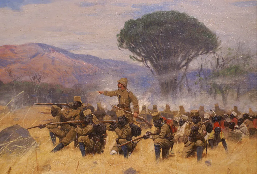 A 1905 painting by Wilhelm Kuhnert of the fighting at Mahenge, with fighters advancing across open ground towards the German post