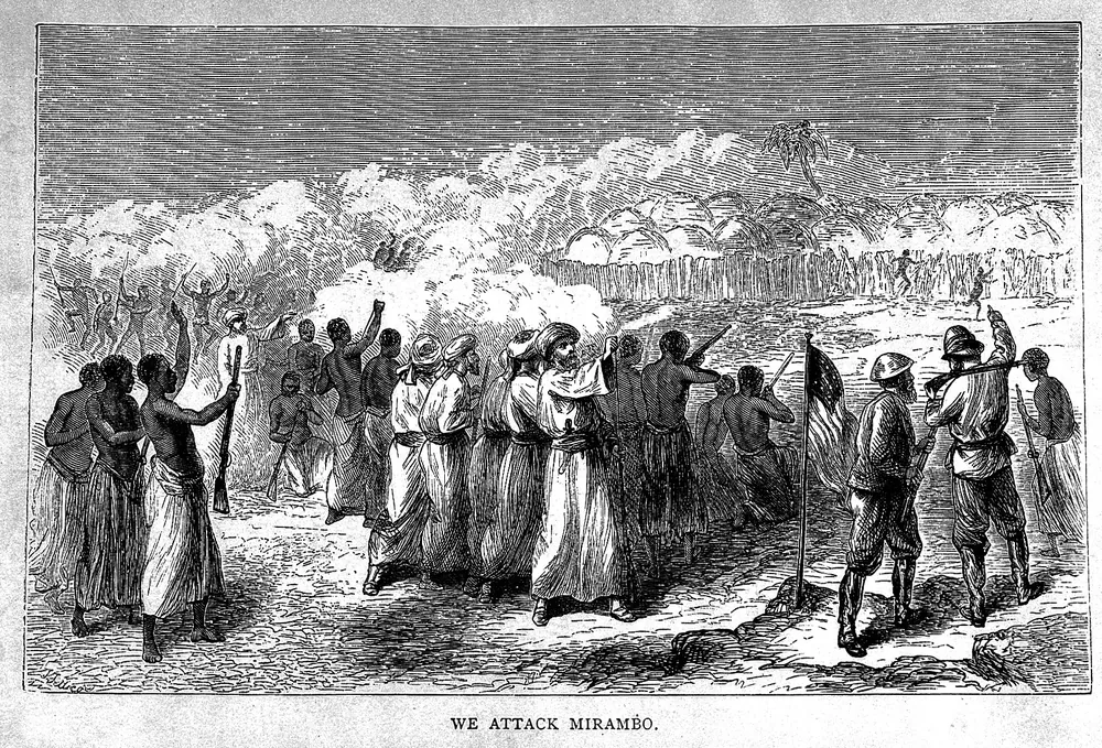 Engraving of Stanley's party and armed men advancing through smoke, titled We attack Mirambo