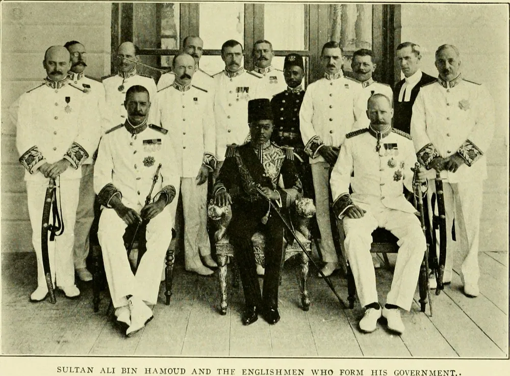 Sultan Ali bin Hamoud with the British officials who ran his government, from a book published in 1910.