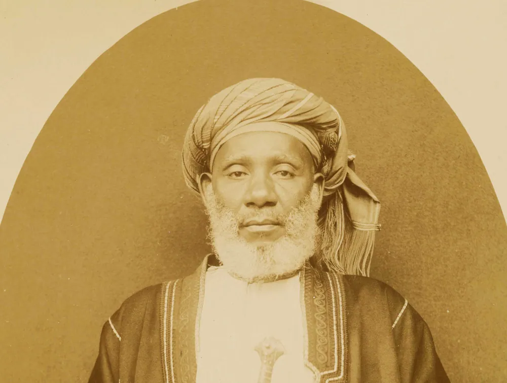 Studio portrait of Tippu Tip in a white turban, head and shoulders