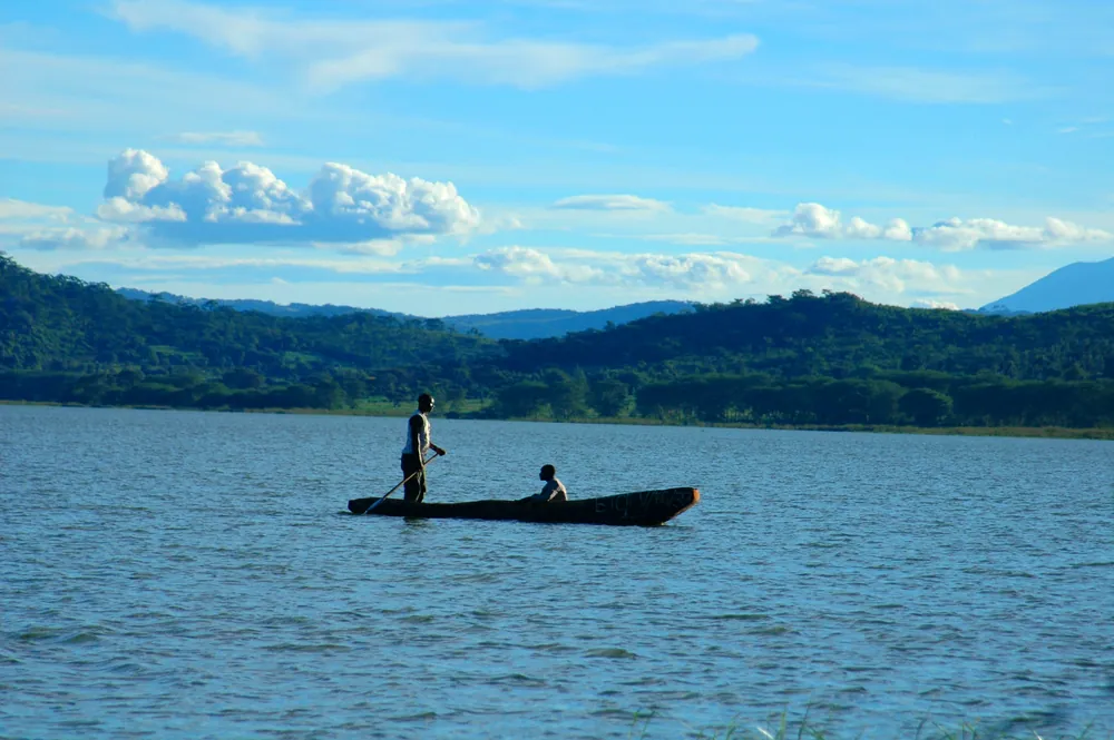 A canoe on Lake Babati, below the hills of the rift