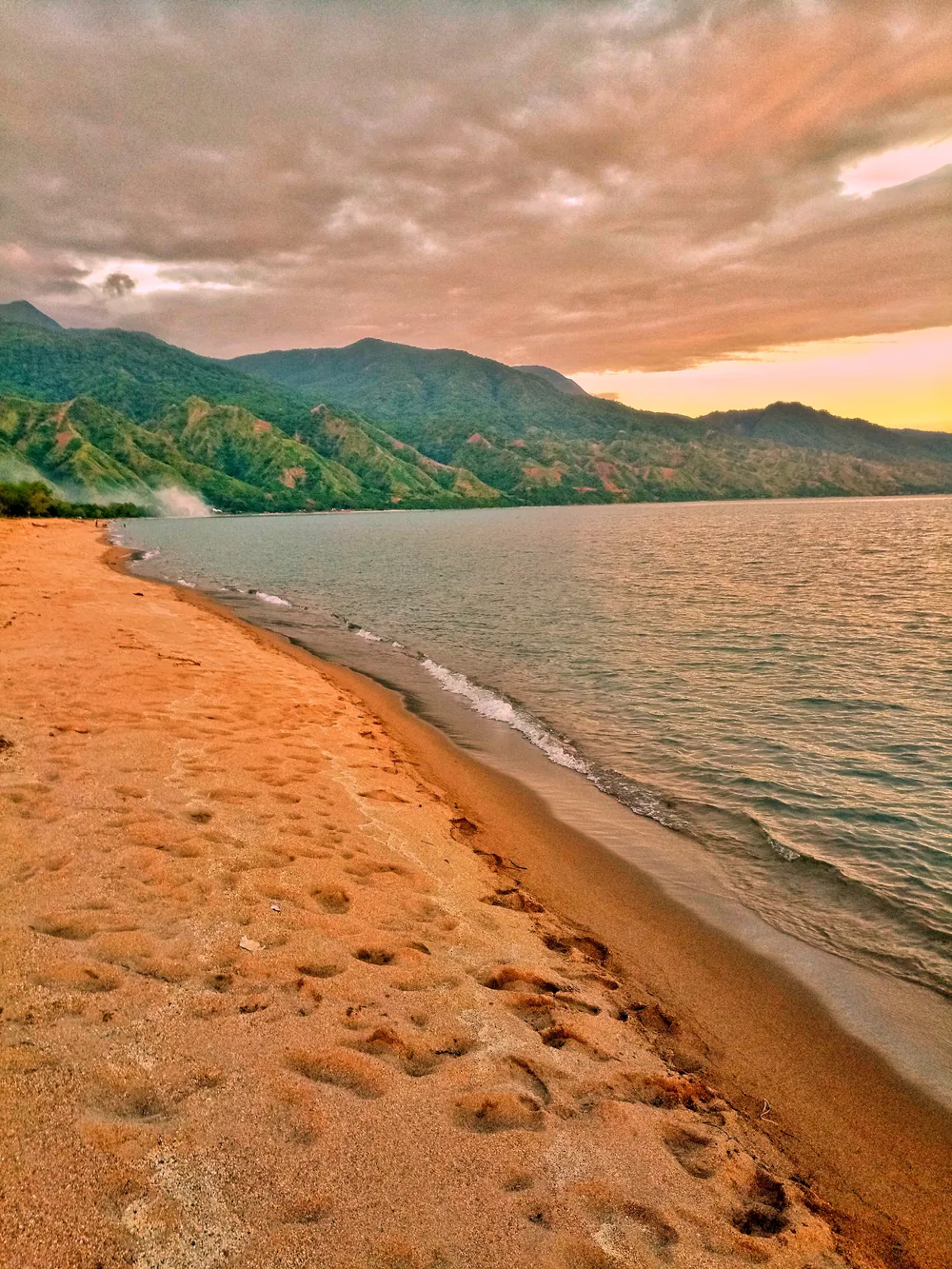 The beach at Matema on Lake Nyasa, beneath the Livingstone Mountains