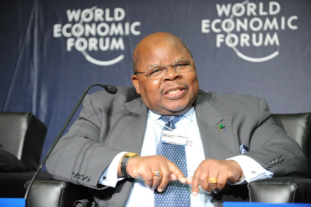 Benjamin Mkapa speaking, seated, at the World Economic Forum on Africa