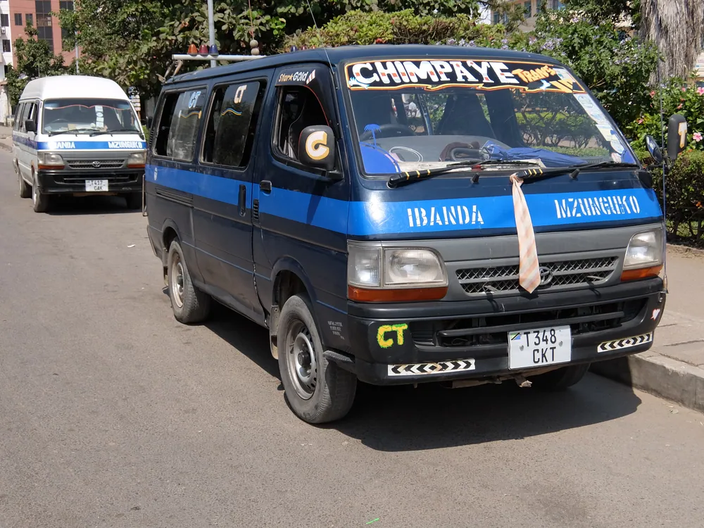 Two dala-dala minibuses at a stop in the centre of Mwanza
